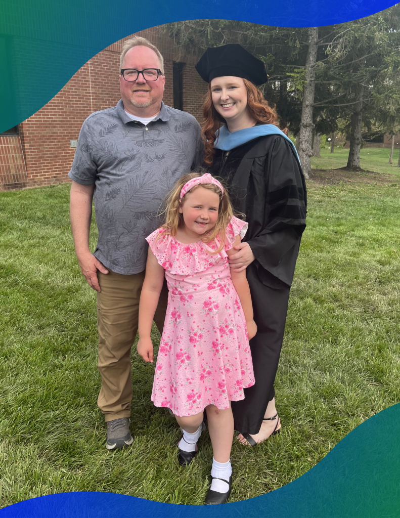 Greg Graham and daughters Anne and Haley pose for Haley's graduation day.